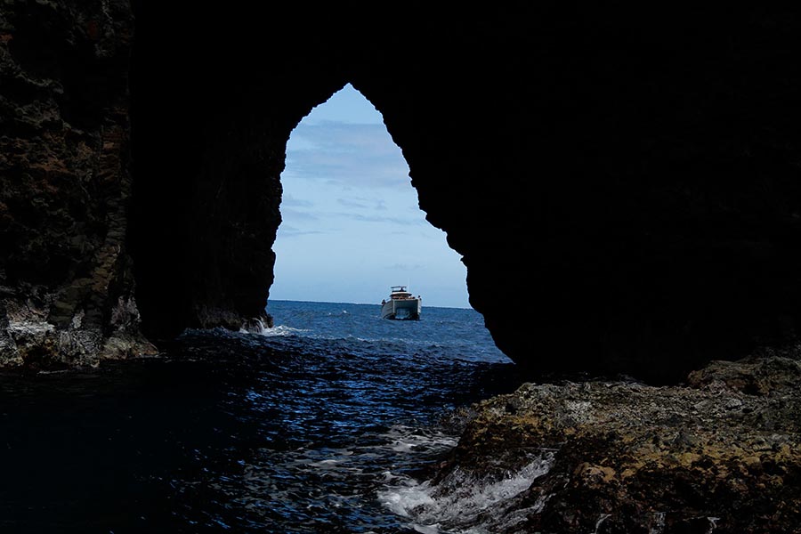 Entering one of the many Caves on the Na Pali Coast. Our boats are small enough to fit in the caves, yet stable enough to navigate variable conditions.